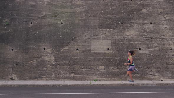 Caucasian woman running on the street