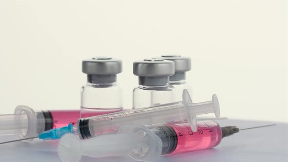 Syringes and Vials of Vaccine From the Virus Covid 19