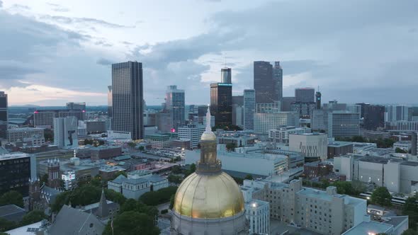 Slow aerial rotating footage of the statue on top of the Capitol Building in downtown Atlanta, Georg