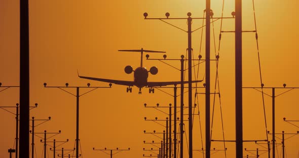 Jet Landing At Airport At Sunset