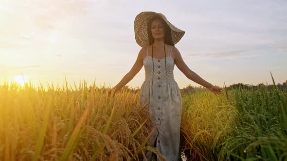 Teenage Girl Enjoy with Sun in the Evening Glow. Beauty Girl Outdoors Enjoying Nature