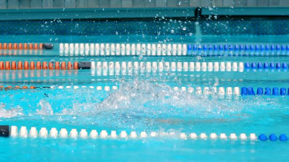 Male swimmer swimming inside pool 4k