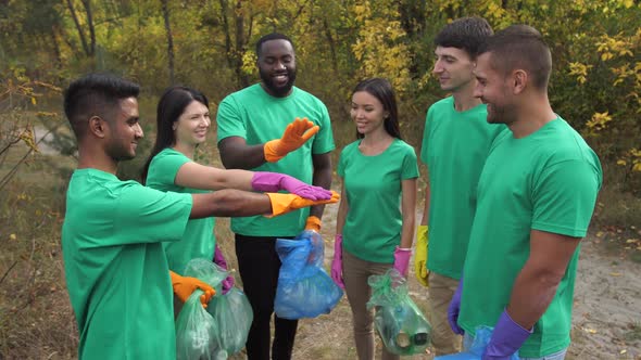 Multiracial Volunteers Rejoicing at Work Done