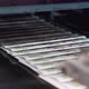 Printed Paper Newspapers are Moved Along Conveyor - VideoHive Item for Sale