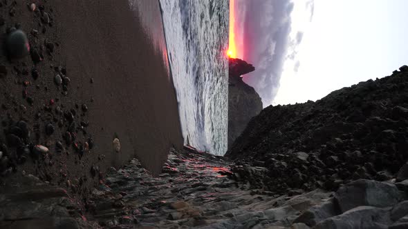 Colorful Warm Sunset Over the Sea and Volcanic Basalt Rocks Like in Iceland