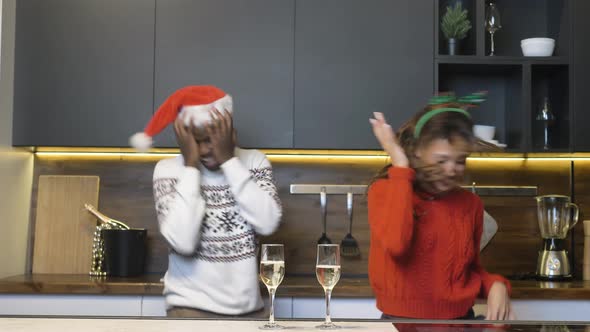 Black Couple Dances Near Glasses and Bottle of Champagne