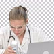 Young female doctor typing on laptop, Alpha Channel - VideoHive Item for Sale