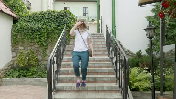 Young Woman Running on Stairs