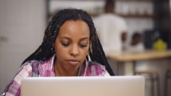 African Young Businesswoman Working From Home on Laptop