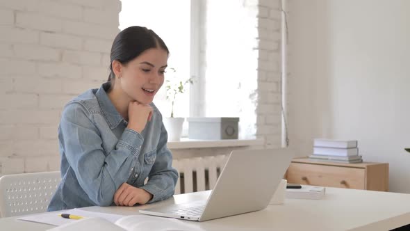 Online Video Chat on Laptop By Young Girl