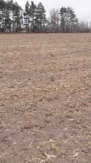 Vertical Video of a Field with Plowed Land in Autumn Slow Motion