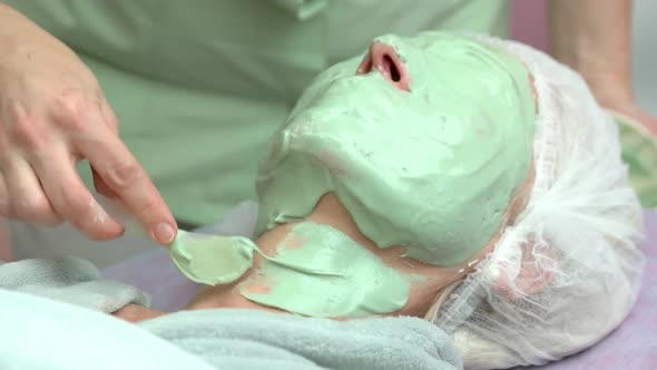 Cosmetician Applying Alginate Facial Mask