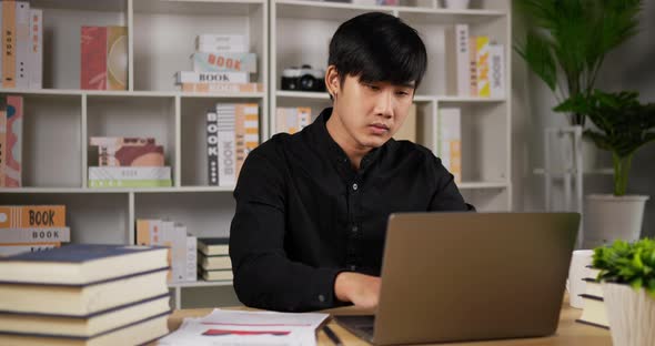Focused businessman working laptop