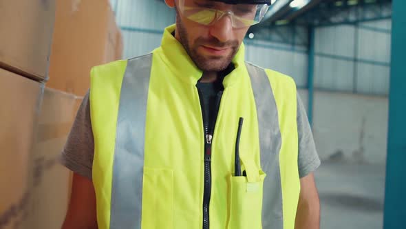 Professional Industry Worker Close Up Portrait in the Factory or Warehouse