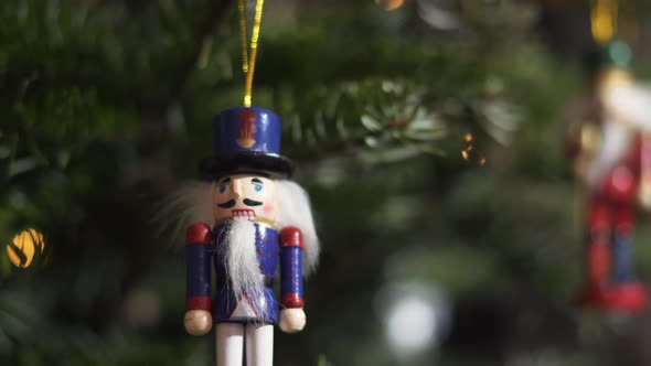 Nutcracker Soldier Toy on a Christmas Tree With Blurred Background Dolly 4K Shot.