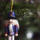 Nutcracker Soldier Toy on a Christmas Tree With Blurred Background Dolly 4K Shot. - VideoHive Item for Sale