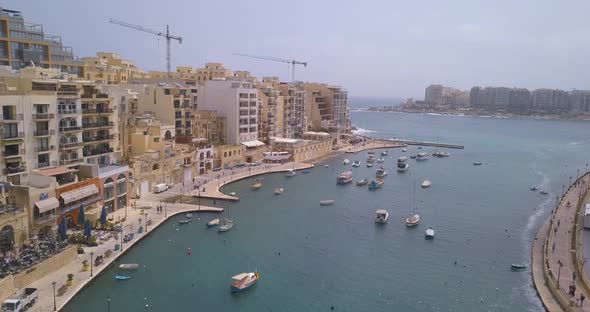 Spinola Bay with Traditional maltese Luzzu