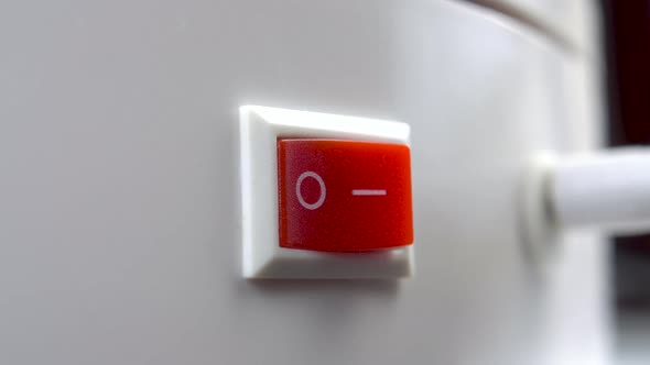 Turn off the electrical appliance by pressing the red switch to the off mode