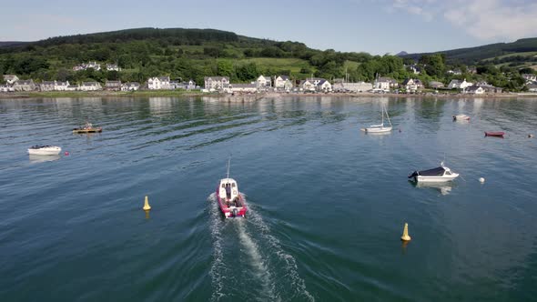 A Small Ferry Arriving into Port in the Summer