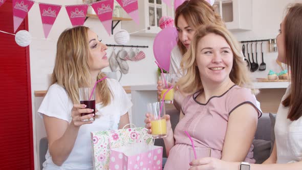 Pregnant Woman Getting Gift at Baby Shower Party