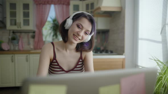 Young Beautiful Brunette Woman Listening To Music