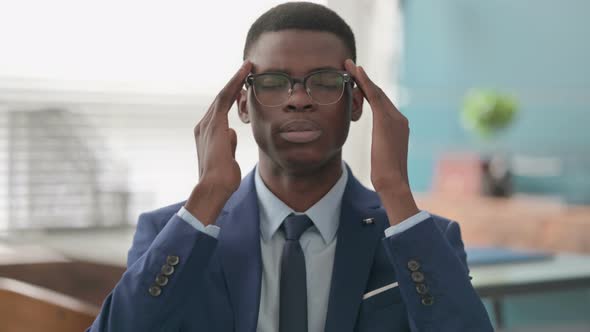 Young African Businessman Having Headache