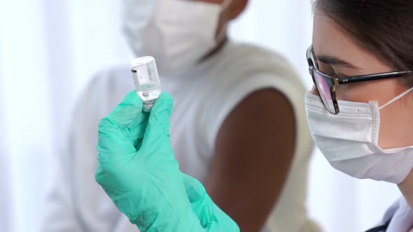 Young Man Visits Skillful Doctor at Hospital for Vaccination