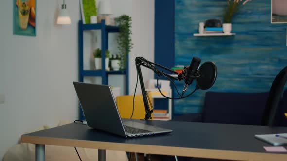 Professional Podcast Microphone of Influencer in Empty Living Room