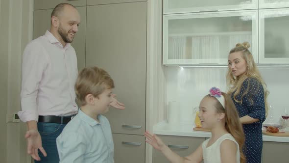 Ordinary Family Spending Morning in the Kitchen