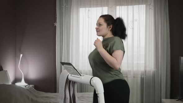 Girl Running on treadmill at home