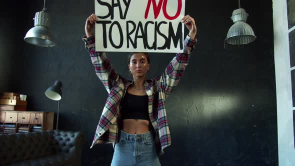 Young Outraged Holding Protest Banner Demanding Stop Racial Discrimination