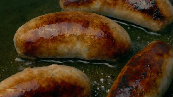 Sausages Frying In Pan