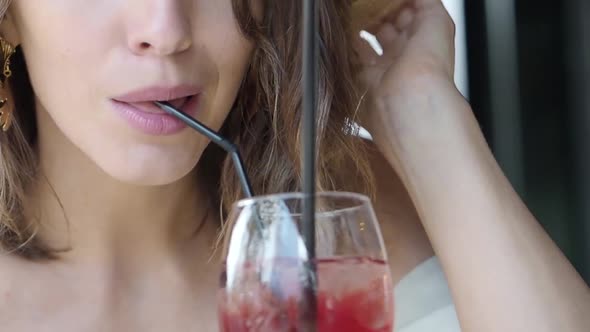 Close Up Lips of a Woman Drinking Coctail.