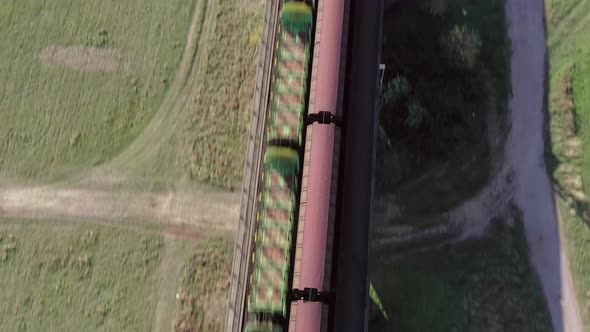Freight Trains Crossing a Bridge at High Speed