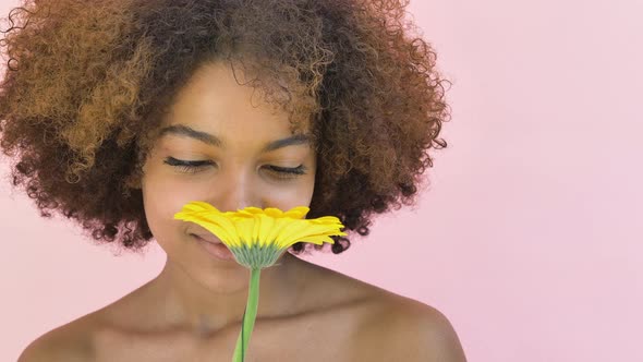 Professional African American Model Poses with Yellow Flower