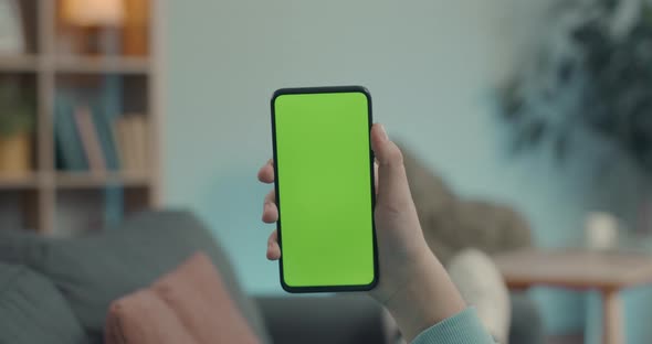 Close Up of Smartphone with Chroma Key Screen on Male Hand
