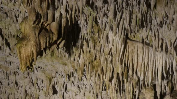 Natural underground space walls 3840X2160 UltraHD tilting footage - Stalactite decorations inside ca