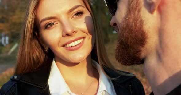 Close Portrait of Happy Couple in Love Admiring and Kissing Each Other at Camera