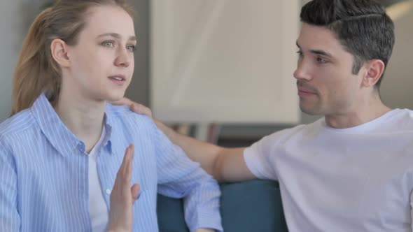 Young Man Talking with Girlfriend