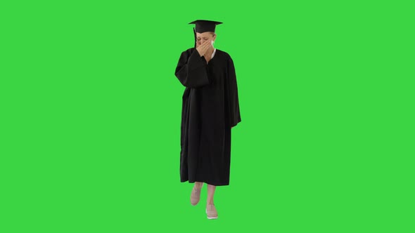 Young Graduate Woman Sick and Coughing While Walking on a Green Screen, Chroma Key