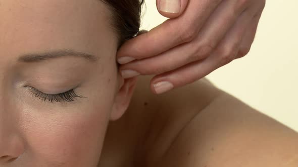 Woman having her face massaged