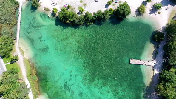 birds eye view of a beautiful lake with turquoise water.