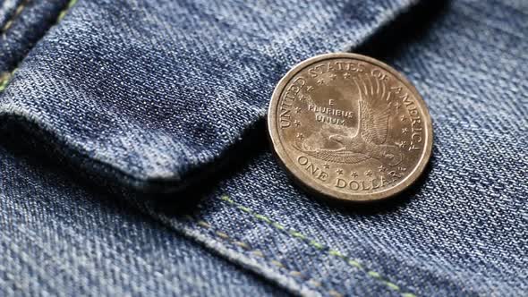 Dollar Coin On a Denim Fabric