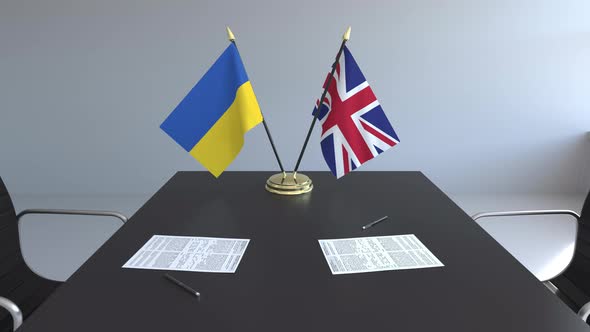 Flags of Ukraine and the United Kingdom and Papers