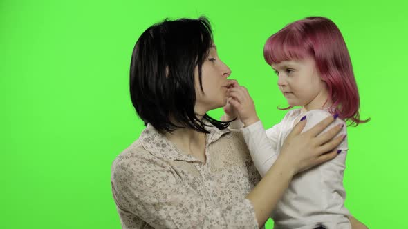 Mother and Daughter Enjoying Playing, Hug, Embrace, Kiss. Mothers Day. Family