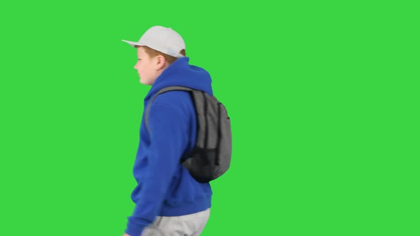 Schoolboy with Backpack Walking By on a Green Screen Chroma Key