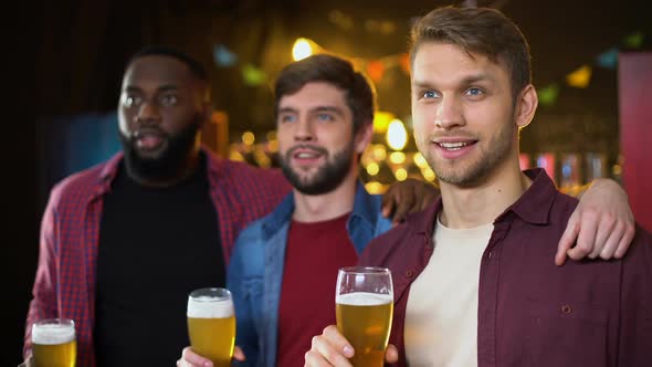 Smiling Cheerful Male Friends Clinking Beer Glasses Team Victory in Championship