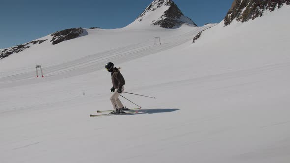 Young Woman Skiing Downhill Slope