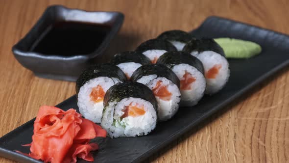 Sushi on a Wooden Table in Restaurant Delicious Japanese Food Sushi Rolls