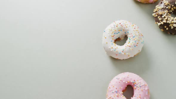 Video of donuts with icing on white background